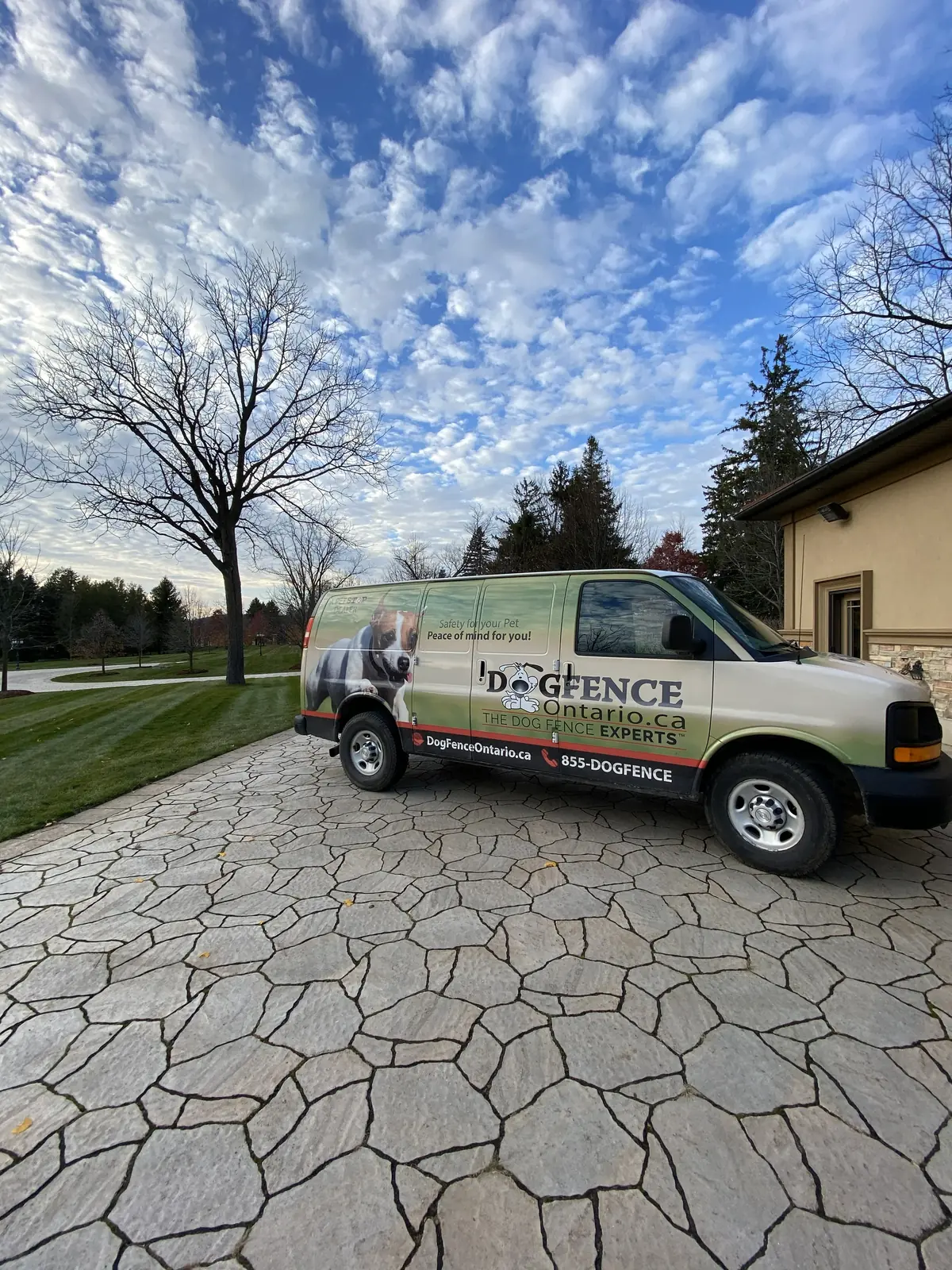 Dog Fence Ontario service van with happy dog